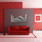 Red-themed room featuring a gray wall art of dolphins above a red couch, with plants and decorative items.