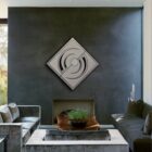 Modern living room features a diamond-shaped wall display and a cozy seating area with a coffee table.