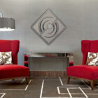 Two red armchairs with decorative pillows face a mirrored console table under a modern lamp. A geometric wall art piece hangs above.