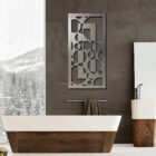 Modern bathroom features a freestanding tub, sleek sink, and decorative wall art. Snowy landscape visible outside.