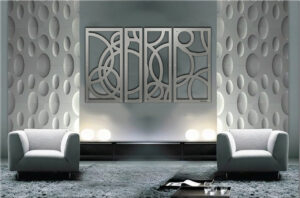Modern living room features gray walls, circular decor, and a four-panel abstract wall art piece. Two gray sofas face each other.