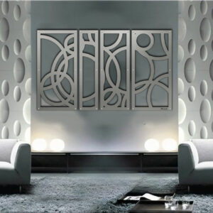 Modern living room features gray walls, circular decor, and a four-panel abstract wall art piece. Two gray sofas face each other.