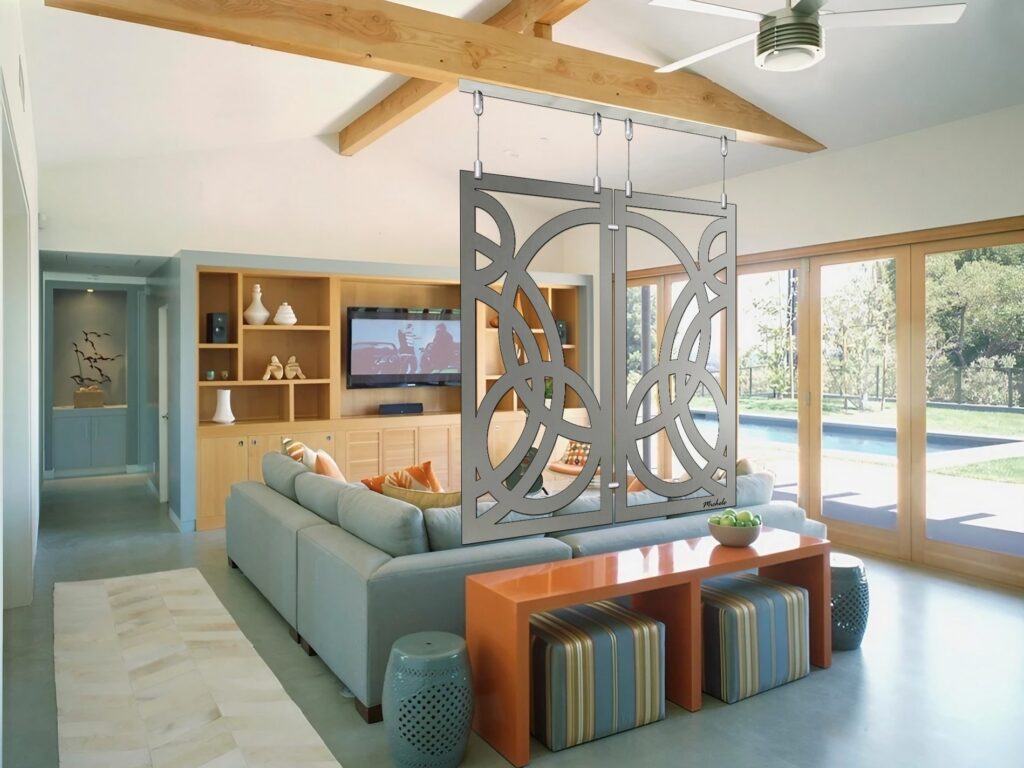 Modern living room with a decorative partition, sofa, and large windows overlooking a pool.