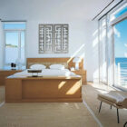 Bright, modern bedroom with a large bed, decorative wall art, and ocean view through glass doors.