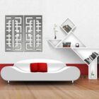 Modern living room featuring a white sofa with red cushions, geometric wall art, and stylish shelves with books and decor.