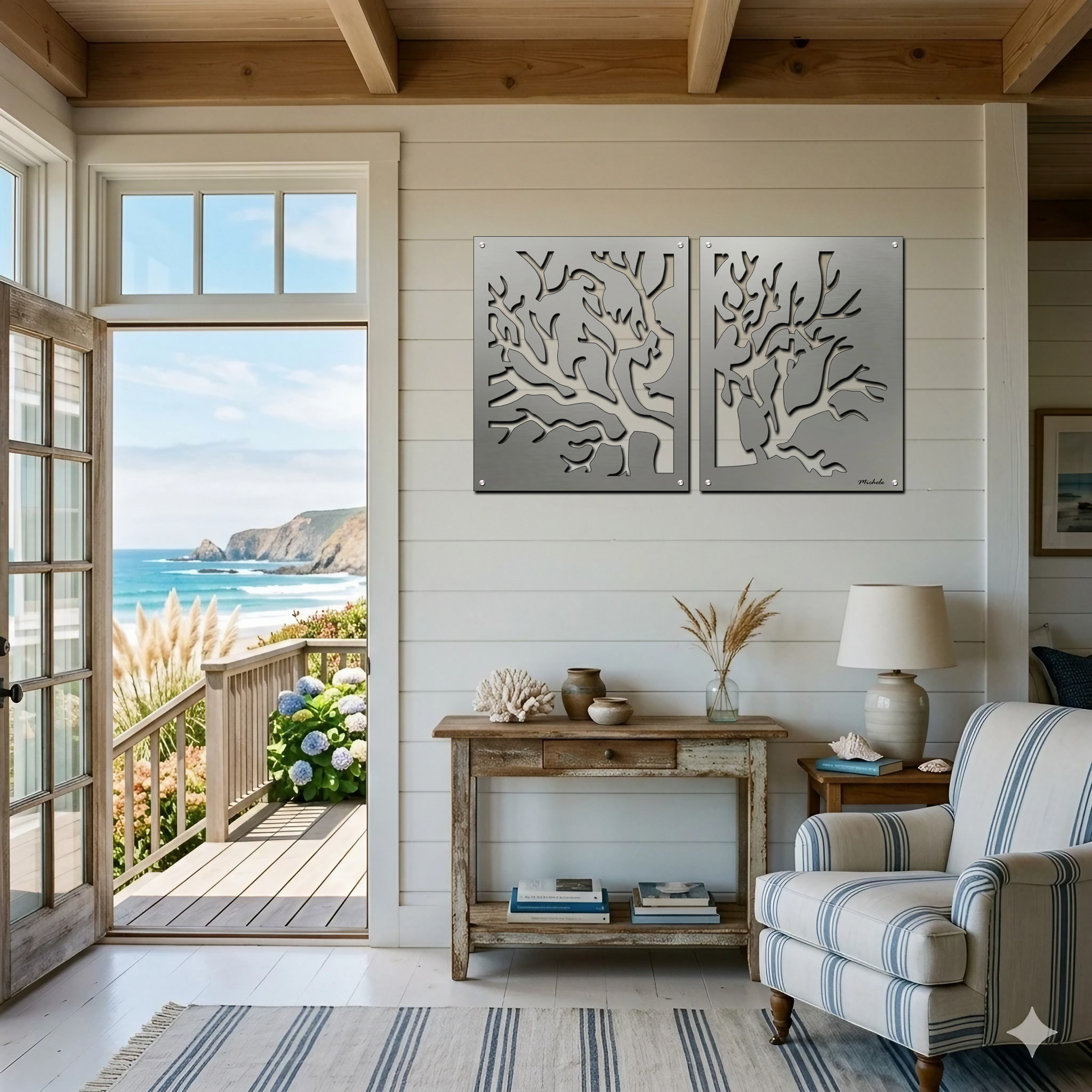 A coastal living room features metal coral art, a wooden table with decor, and a view of the ocean.