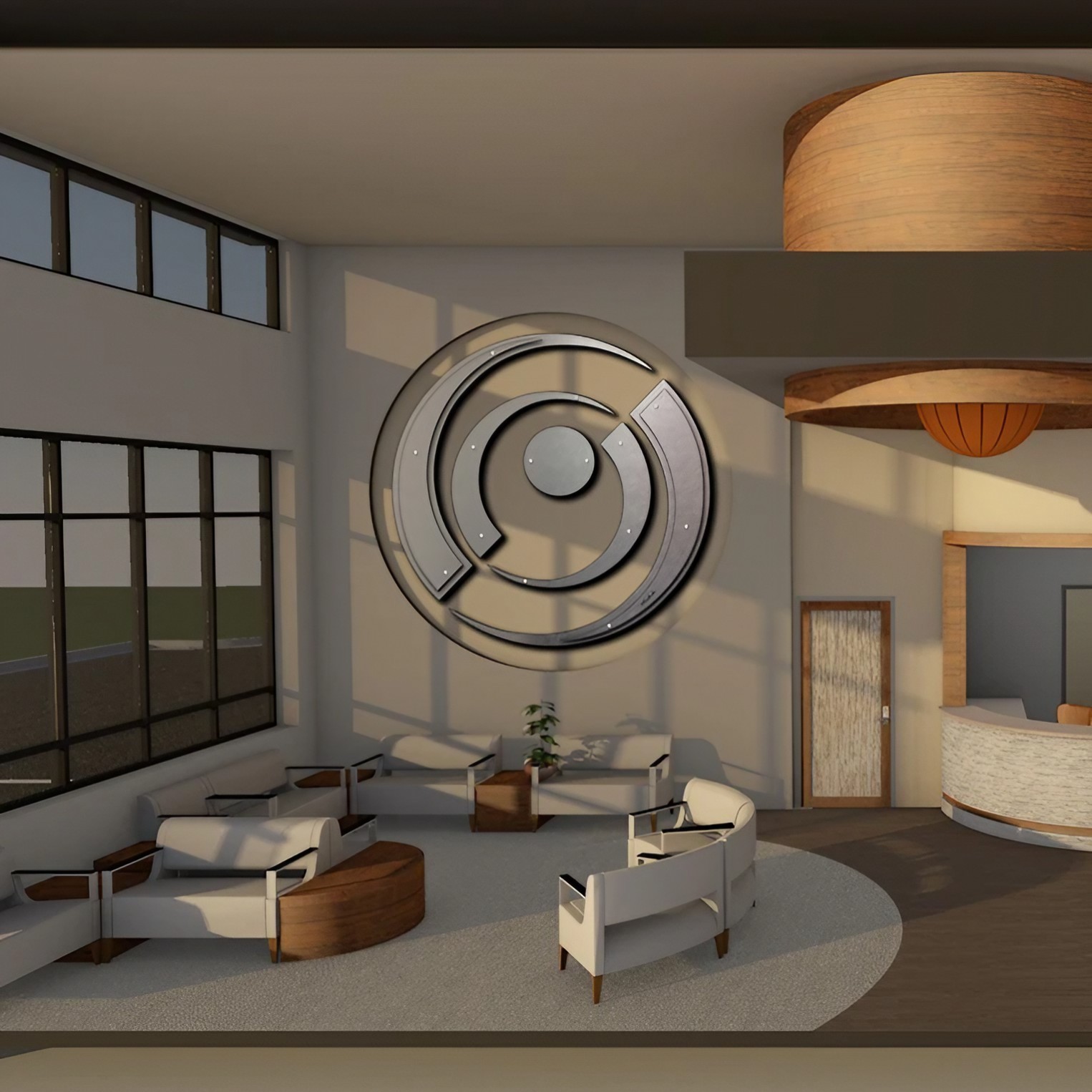 inphinitee 40-1 top and bottom 5-23-26 office-1 Modern office lobby with circular artwork, seating areas, and a reception desk. Natural light fills the space.