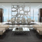 Modern office interior with a glass partition, seating area, and a view of the ocean.