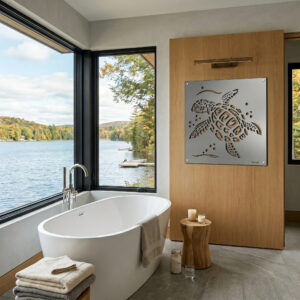 A modern bathroom features a sea turtle metal art piece on a wooden wall, overlooking a scenic lake view.