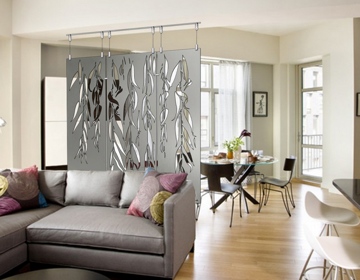 A living room features a decorative curtain with weeping willow designs, a gray sofa, and a dining area.