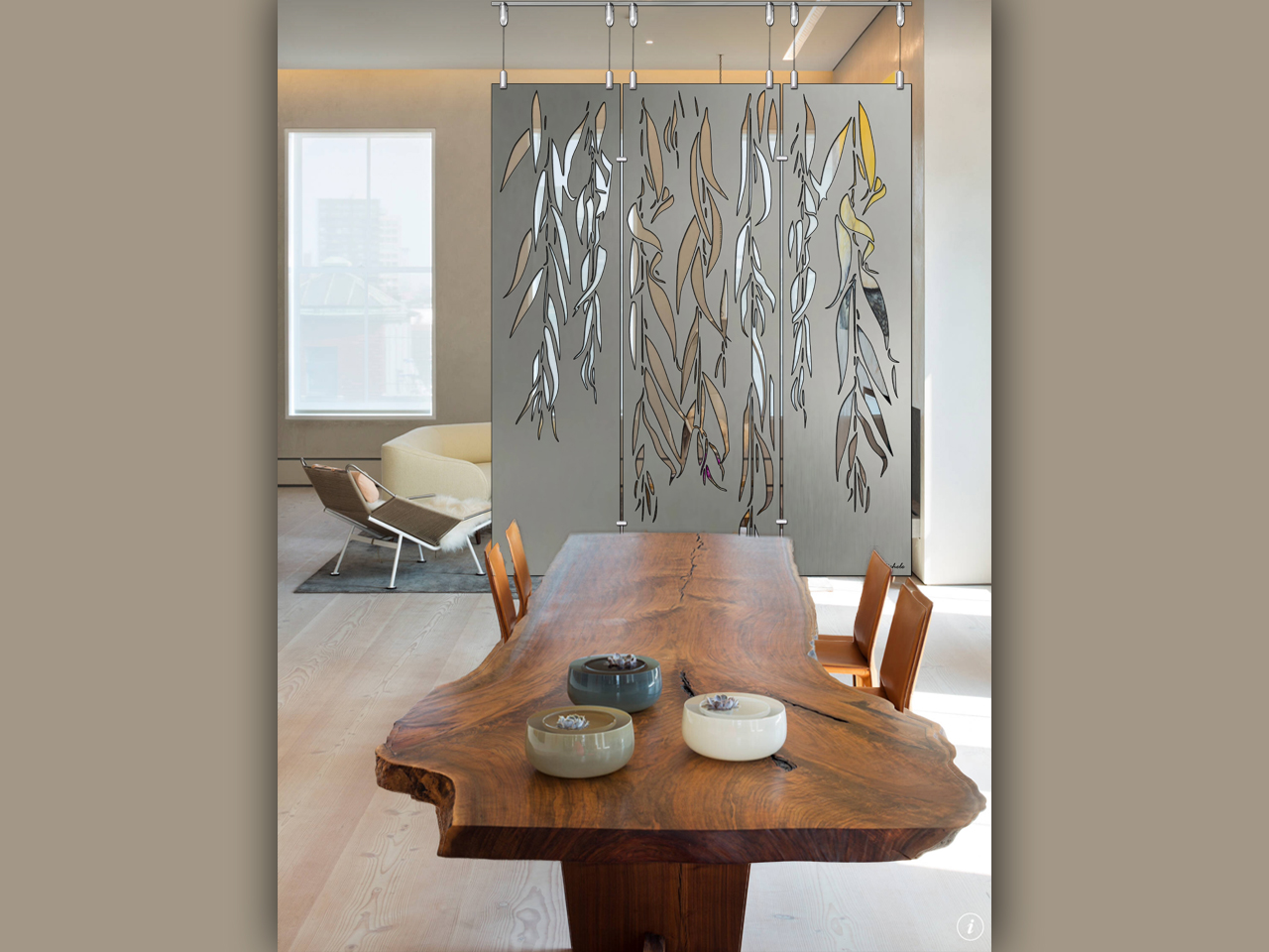 weeping willows 59x69 ver1 6-26-26 livingroom A wooden dining table with decorative bowls, a partition featuring weeping willow designs, and a modern chair.