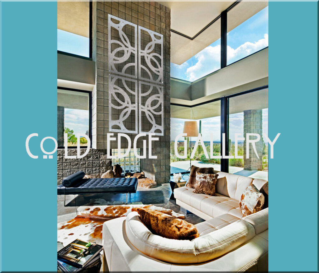 Modern living room with large windows, a white sofa, and abstract wall art. Natural light fills the space.