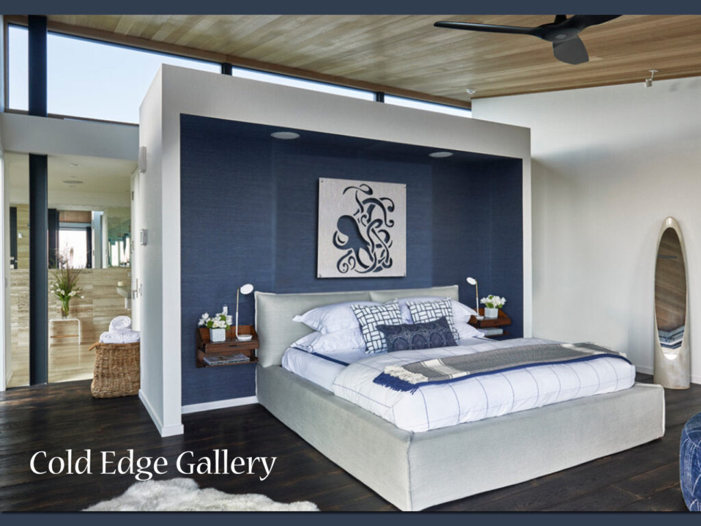 Modern bedroom with a large bed, decorative wall art, and a mirror. Natural light fills the space.