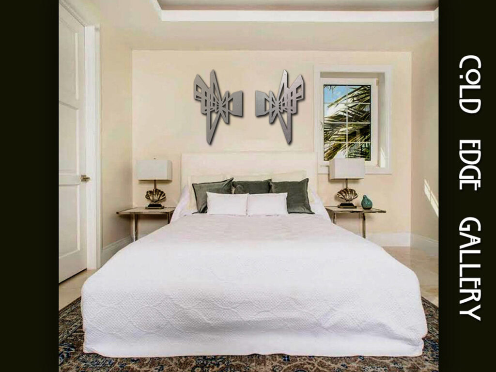 A modern bedroom features a large bed, decorative pillows, and abstract wall art above.