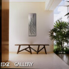 A modern bench and potted plants are arranged in a minimalist indoor setting with custom metal artwork on the wall. Text reads "Cold Edge Gallery.