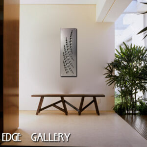 A modern bench and potted plants are arranged in a minimalist indoor setting with custom metal artwork on the wall. Text reads "Cold Edge Gallery.