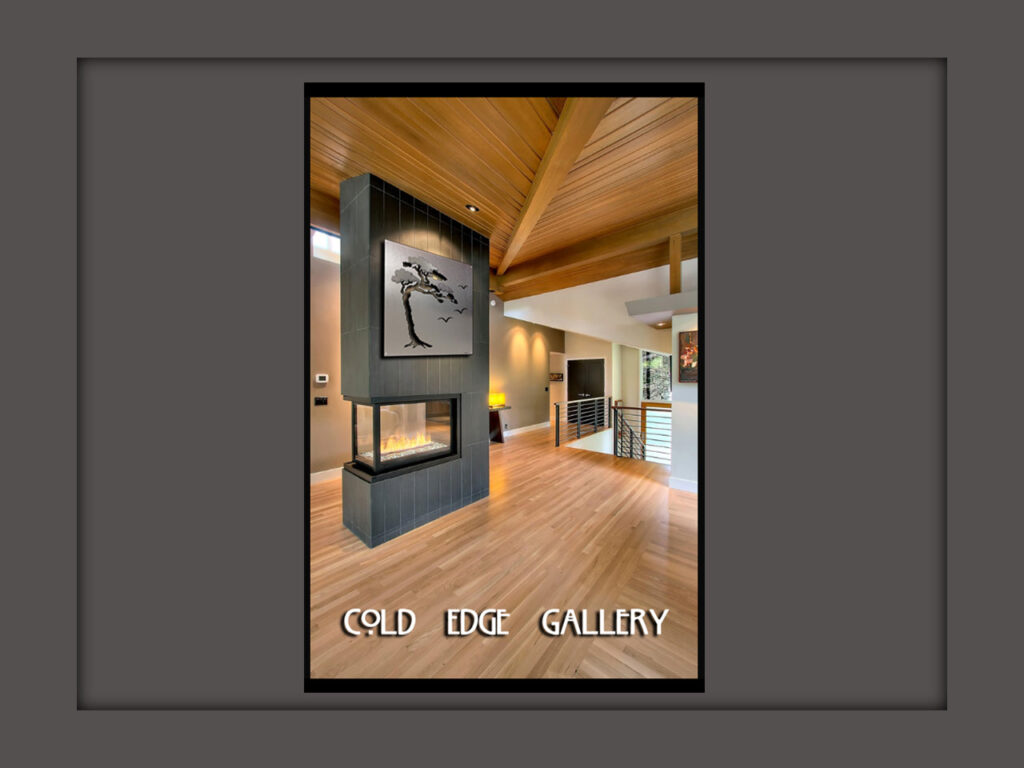 Modern gallery interior featuring a central fireplace and artwork of a tree. Wood accents and open space create a welcoming atmosphere.
