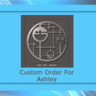 A framed abstract metal artwork with geometric shapes. The display text below reads "Custom Order For Ashley.