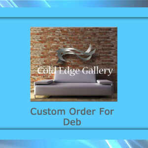 A modern sofa placed against a brick wall beneath metallic artwork, with the text "Cold Edge Gallery" and "Custom Order For Deb" displayed on a blue border.