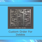 A metal artwork is displayed within a blue frame. The text "Custom Order For Debbie" is written underneath the artwork. The bottom of the artwork says "Cold Edge Gallery.