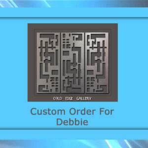 A metal artwork is displayed within a blue frame. The text "Custom Order For Debbie" is written underneath the artwork. The bottom of the artwork says "Cold Edge Gallery.