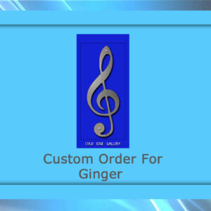 A blue framed graphic featuring a metal treble clef symbol. Text below reads "Custom Order For Ginger" with the words "Cold Edge Gallery" at the top, showcasing bespoke artwork.