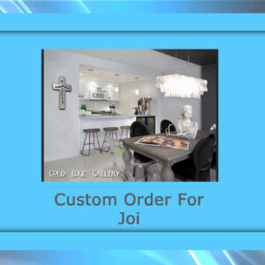Interior of a modern kitchen and dining area featuring custom artwork, a metal sculpture, and a chandelier. A cross adorns the wall. Text reads "Custom Order For Joi" and "Cold Edge Gallery.