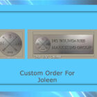 Two silver plaques with the logos and text "No Boundaries Marketing Group" and "Cold Edge Gallery." Caption below reads, "Custom Order For Joleen." The background is blue with streaks of light.