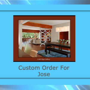 Framed picture of a modern dining room with caption "Custom Order For Jose." The room features a dining table, large windows, and decorative wall panels. The frame is light blue and brown, highlighting the custom artwork and adding an elegant touch to the space.