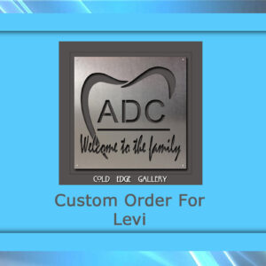 A framed metal artwork featuring a tooth design and the text "ADC Welcome to the family." Below, "Custom Order For Levi" on a light blue background.
