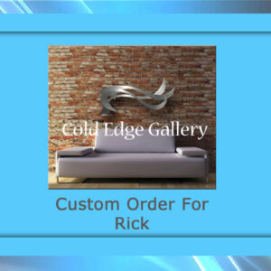 Image of a modern metallic fish sculpture mounted on a brick wall above a gray sofa. Text reads "Cold Edge Gallery" and "Custom Artwork For Rick." The image is framed with a blue border.