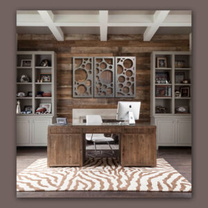 Modern office with a wooden desk, white chair, and shelves displaying sports memorabilia. Zebra-patterned rug on the floor.