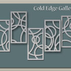 Abstract metal wall art with geometric and circular cutouts against a blue background. The text "Cold Edge Gallery" is in the upper right corner.
