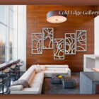 Modern living room with a white sectional sofa, abstract wall art, bar stools, and large windows. "Cold Edge Gallery" text appears in the upper right corner.