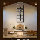 Interior of a modern church with a cross and crucifixion sculpture above the altar, surrounded by floral arrangements and liturgical furniture. The image has the text "COLD EDGE GALLERY" at the bottom.