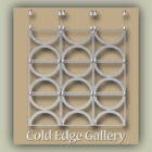 A metal wall art piece with a grid of interconnected circular segments, displayed on a neutral background. The text "Cold Edge Gallery" is at the bottom.