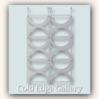 A symmetrical display of six vertical metal rings mounted on a light blue and beige background titled "Cold Edge Gallery.