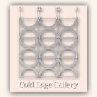 An arrangement of nine metallic rings in a 3x3 grid, each secured with metal clamps on a wall. The text "Cold Edge Gallery" is displayed at the bottom.
