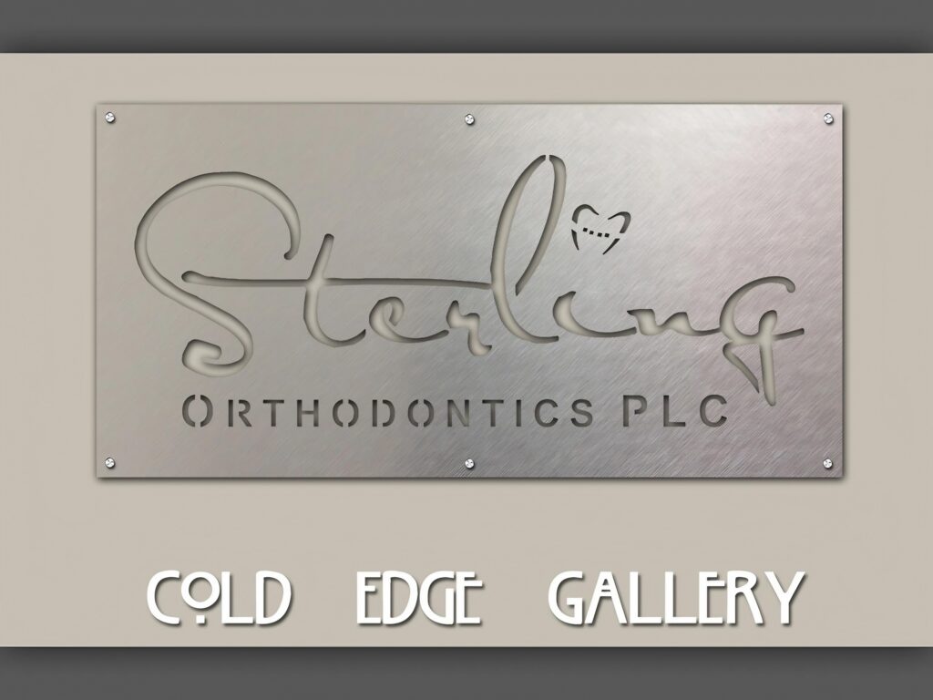 custom-sign-for-dentists-office-5 Metal sign displays "Sterling Orthodontics PLC" with a heart-shaped tooth design, mounted on a wall.