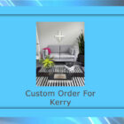 A modern living room features a gray sofa, striped rug, coffee table, and plants.