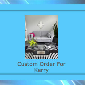 A modern living room features a gray sofa, striped rug, coffee table, and plants.