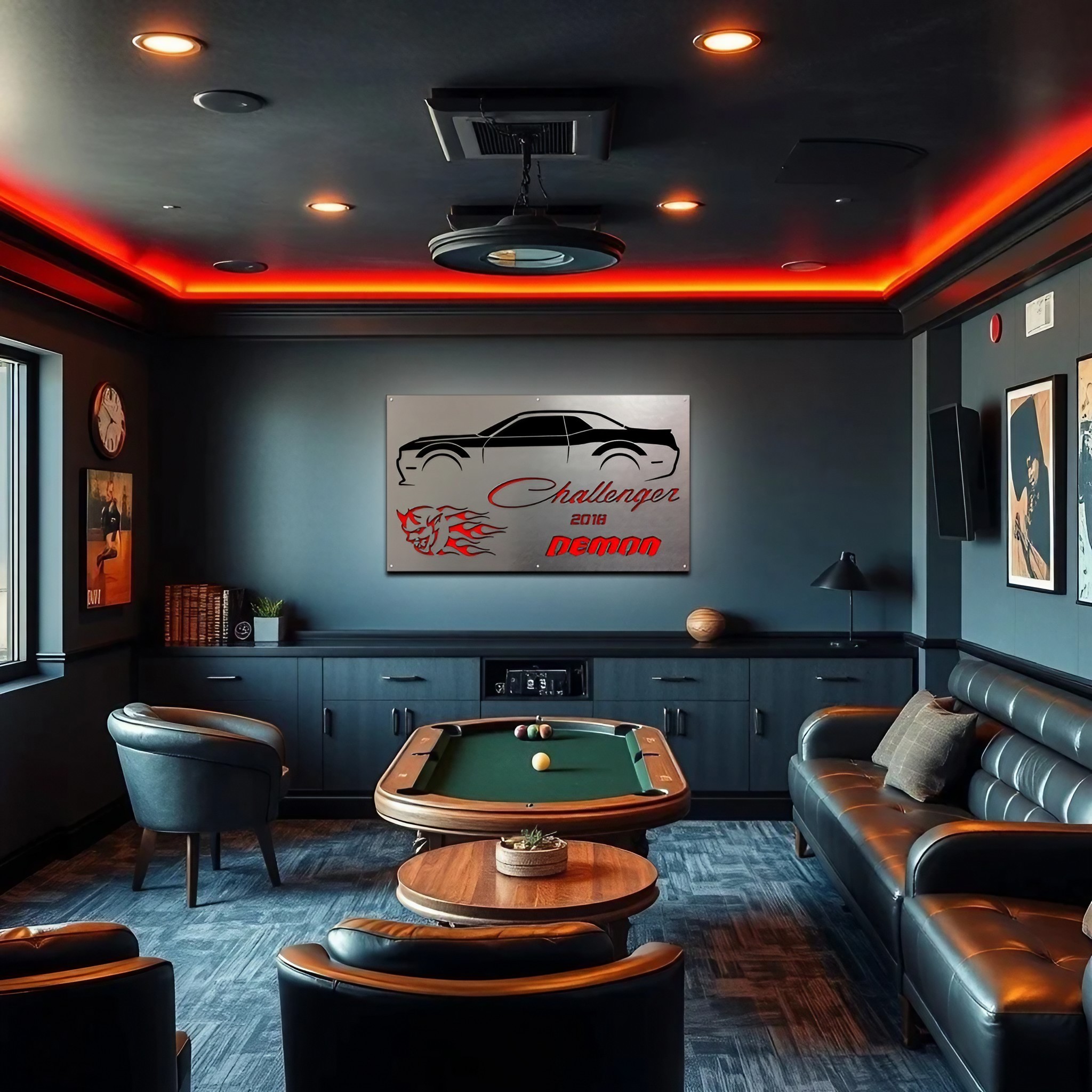 A stylish man cave features a pool table, leather seating, and a wall art of a 2018 Dodge Challenger Demon.