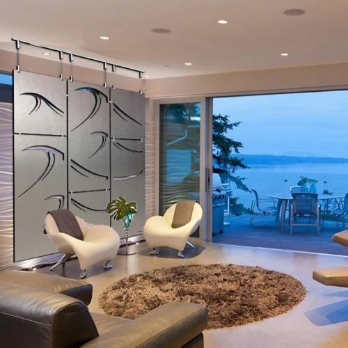 Modern living room features a wave-patterned room divider, stylish chairs, and a view of the ocean.