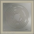 Metal panel featuring a circular maze design with concentric lines, framed in a light-colored border.